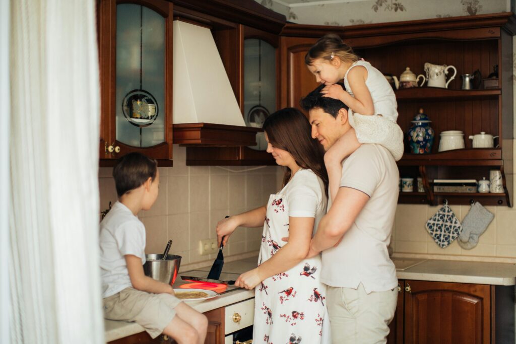 pexels-photo-3807332-3807332 A joyful family cooking together in their cozy home kitchen, showcasing love and togetherness.